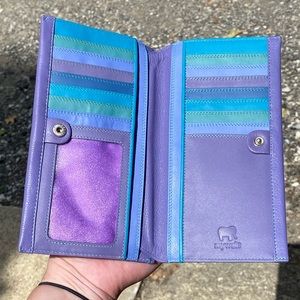 Large 100% leather Mywalit in a purple and teal gradient. NEVER USED